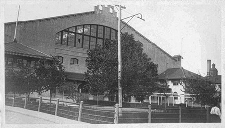 Exterior view of the Cowtown Coliseum in 1913 featuring a large arched window.